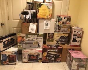 A ton of never used, still in original boxes kitchen appliances - ice cream makers, tabletop grills, roasting pans, rotisseries, ninja blender/chopper sets, beverage dispensers, pots and pans (Paul Deen), food design machines, etc. etc.