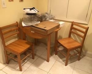Closer shot of table and chairs, and new kitchen appliances and convection cookware (red copper), brand new Stainless Steel set of pots and pans