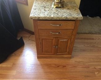small oak and marble top cabinet