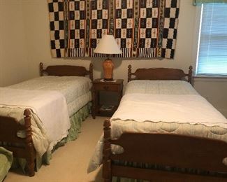 Pair of twin beds.  Wall tapestry is not for sale.