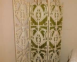 White wicker room divider.