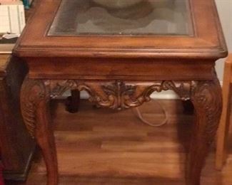 Beautifully detailed wooden table w/ glass top