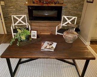 Coffee table made of reclaimed wood and wrought iron