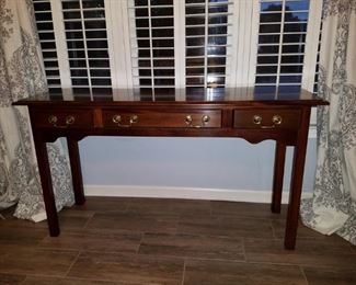 Cherry three-drawer console table