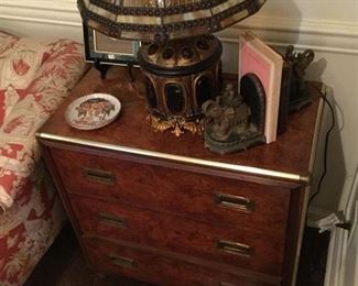 A VINTAGE "BAKER" THREE DRAWER SMALL CHEST WITH BURLED WOOD AND BRASS TRIM ON BUN FEET PRICE$ 675