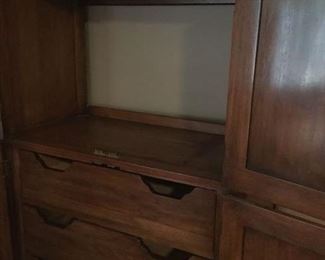 STORAGE SPACE BEHIND TOP PAIR OF DOORS