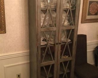 BEAUTIFUL DOUBLE DOOR CABINET LIGHTED WITH GLASS SHELVES ON THE UPPER PORTION PRICE $ 695