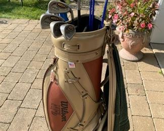 Golf clubs Ping Irons, Titleist woods and NFL golf bag