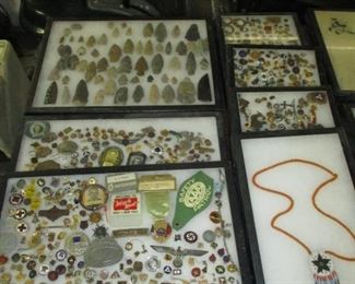 Cases of small pins and badges