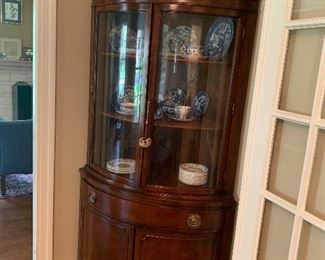 Drexel corner cabinet with curved glass