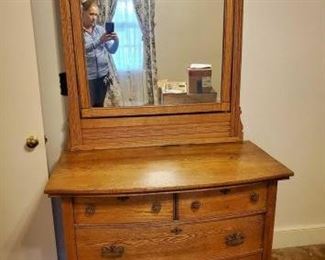 Beautiful antique wooden dresser and mirror.