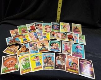 An assortment of Collectible Garbage Pail Kids cards
