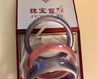 $25 3 glass bangle bracelets small wrist  Pink bracelet is faceted.  Each approx 2" diam. 