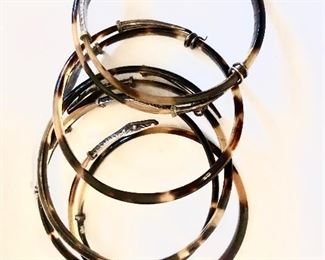 $50 Set of five bangle bracelets with snake design (small wrist).  Each approx 2.25" diam. 