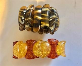 $20 each stretchy bracelets.  Brown tortoise bracelet 2.25" diam.  Orange/yellow bracelet 2.75" diam. 
