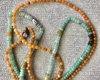 $80 Detail  Green beads 17" L; yellow beads 20" L.