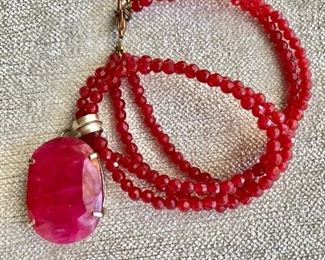 $50 Ruby red necklace and pendant. Beads 14"L, pendant 1" L. 