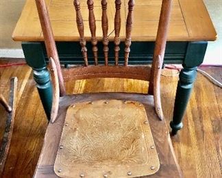 $75 Carved wood chair with tooled leather seat.  17" W, 19" D, 39" H. 