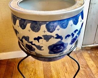 $120 Ceramic blue and white planter on wrought iron base.  Planter 11" H, 13" diam; base 13" H. 
