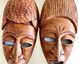 $60 Pair of wooden carved masks Each approximately 12.5" H, 6" W. 