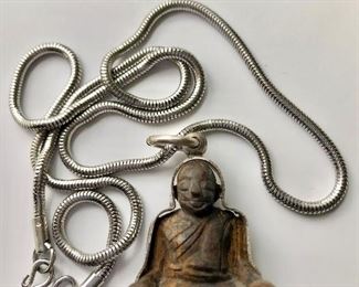 $45 Buddha figure on silver tone chain 