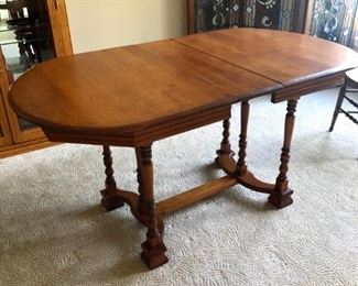 Maple dining room table. 52 x 33 with 2-9" leaves. Lovely turned legs. Very unique