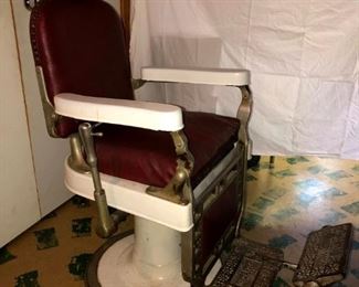 Authentic 1920’s Theo A Kochs Barber Chair in very good condition. Original red leather. Lift works fine.  