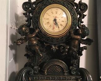 Decorative clock adorned with cherubs