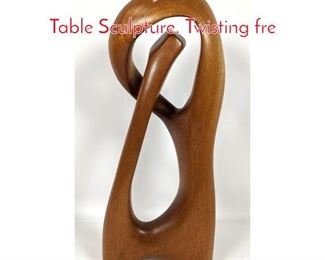 Lot 105 Artist Signed Carved Wood Table Sculpture. Twisting fre