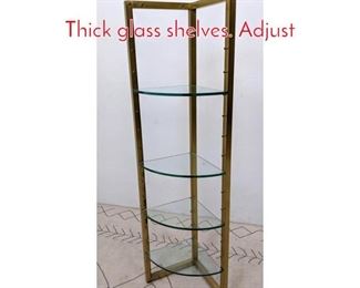 Lot 557 Brass corner etagere shelf. Thick glass shelves. Adjust