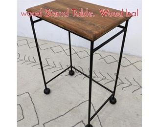 Lot 576 Mid Century Modern Iron and wood Stand Table. Wood bal