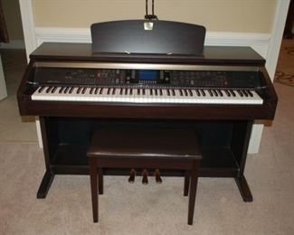 Electric piano	Yamaha Clavinova, 55" W x 25" D x 44" H
