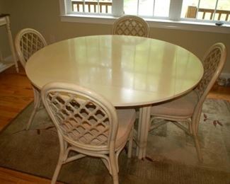 Kitchen round dropleaf table with 4 chairs	Whitecraft Rattan,57" W x 29" H (open) 
