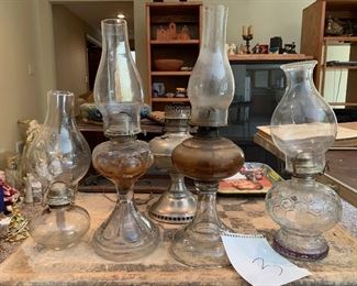 3. set of 5 lamps and 4 hurricane tops $50