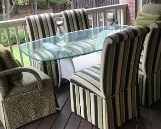 Beautiful Glass and Wicker Outdoor Dining Table with Upholstered Dining Chairs