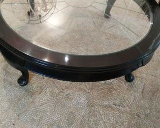 dark wood round coffee table 48 in by 48 in by 16 in with glass insert