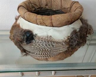 round basket wrap with leather and feathers 13 by 13 by 12 inches high