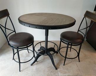 round wooden kitchen table with two chairs 36 by 36 by 37 inches high
