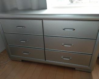 silver 6 drawer dresser with matching 2 drawer end table dresser is 59 in by 16 and by 36 inches high in table is 24 by 16 by 27 inches high