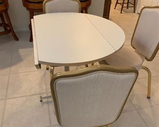 Vintage drop down table with 3 chairs in excellent condition 
