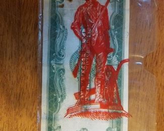 Reverse of $1.00 Silver Certificate showing the Newport News Shipyard Stamp on the holder