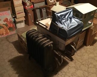 Old radiator and vintage stroller