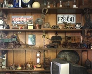 Vintage campaign signs, license plates, cast iron, primitive toys,  Ice tongs, buckles. 