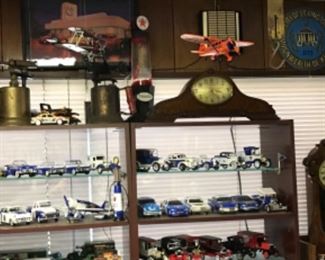 Metal airplanes, vintage blow torches, collectible University of Kentucky models and other models. Vintage signs 