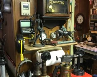 Old Regulator clock, craftsman tool box full of tools, antique phones, bronze jockey, cast iron Don Quixote, brass blow torch 