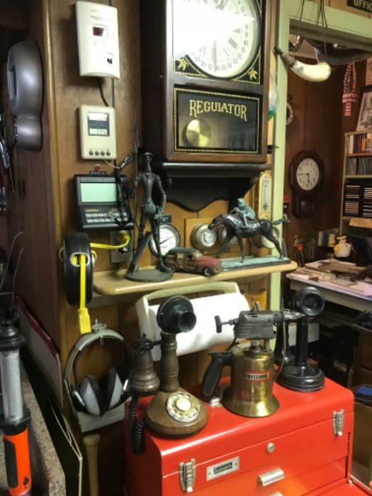 Old Regulator clock, craftsman tool box full of tools, antique phones, bronze jockey, cast iron Don Quixote, brass blow torch 