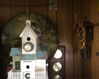 Bird house with large advertising piece in background