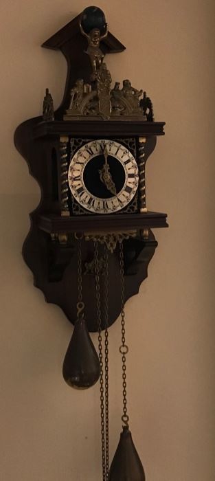 Beautiful cuckoo clock with brass trim 
