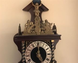 Lovely cuckoo clock with ornate brass trim 