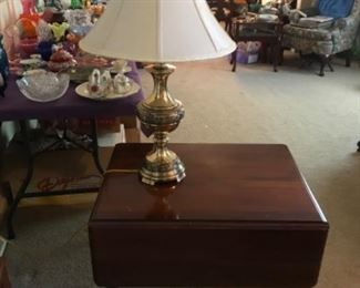 Drop leaf table with brass lamp